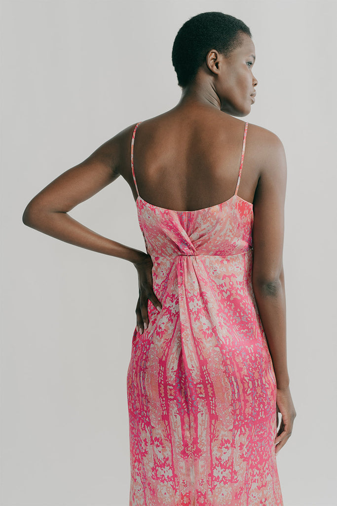 Back view, Sienna features back twists on the empire line