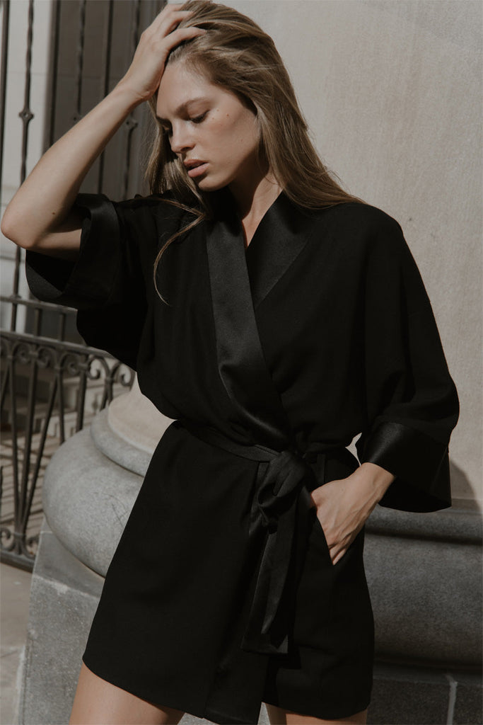 Jodi mini dress in black wool crepe with kimono collar and sleeve cuffs in silk satin