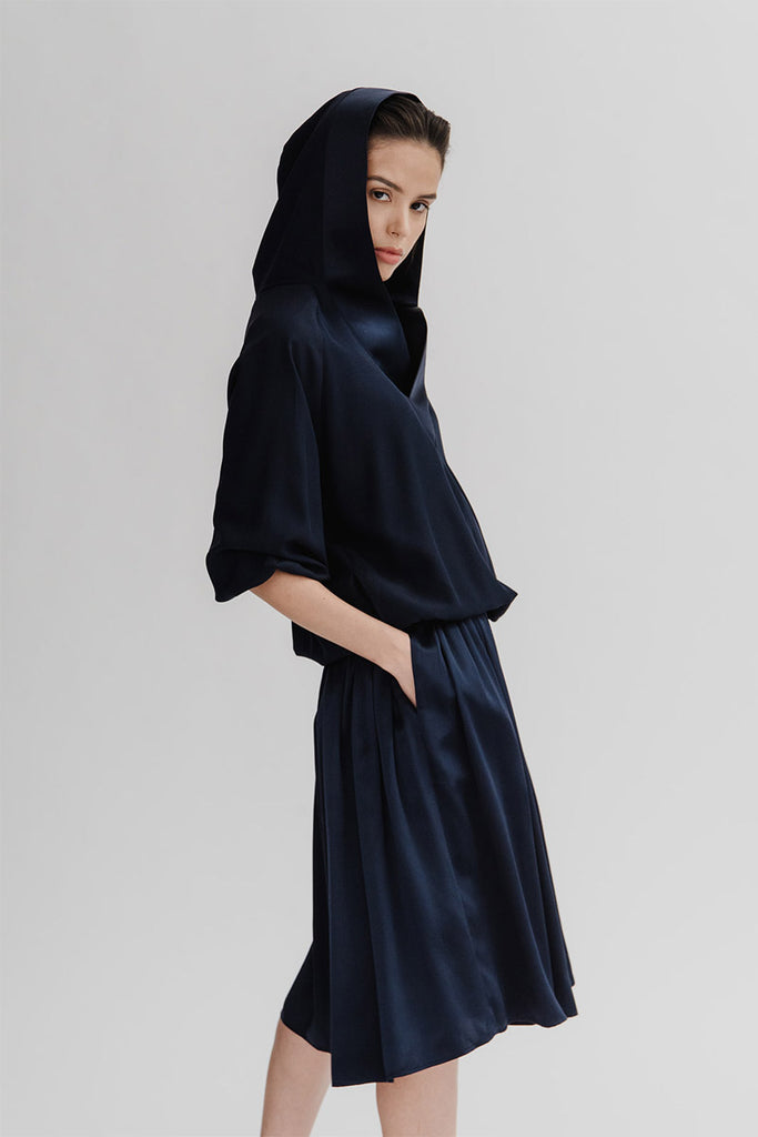 Neneh hoodie styled with Kouka midi skirt, both in Navy silk